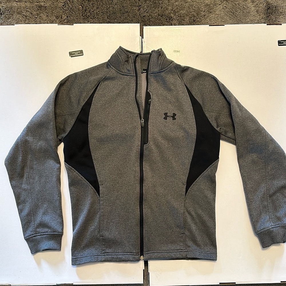 Under Armoir zip up grey men’s sweatshirt.